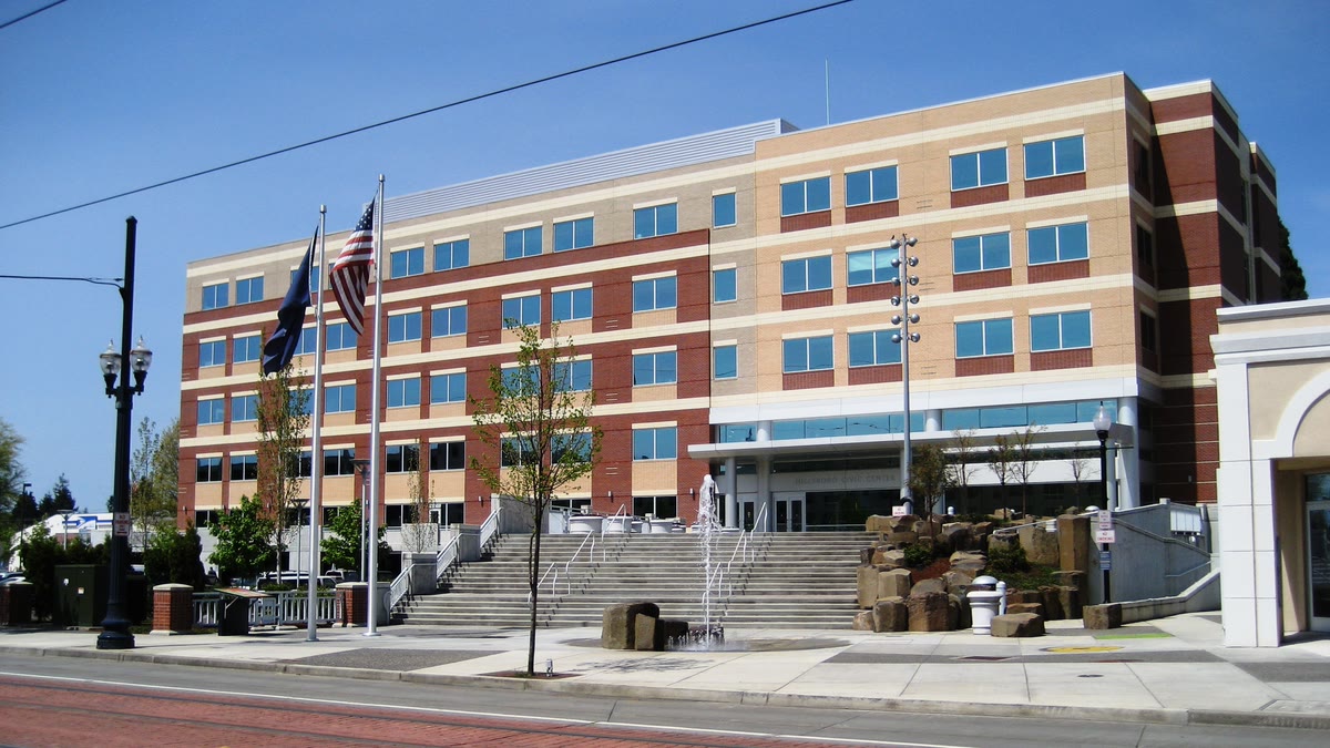 The Hillsboro Civic Center with flags and a stepped plaza in front