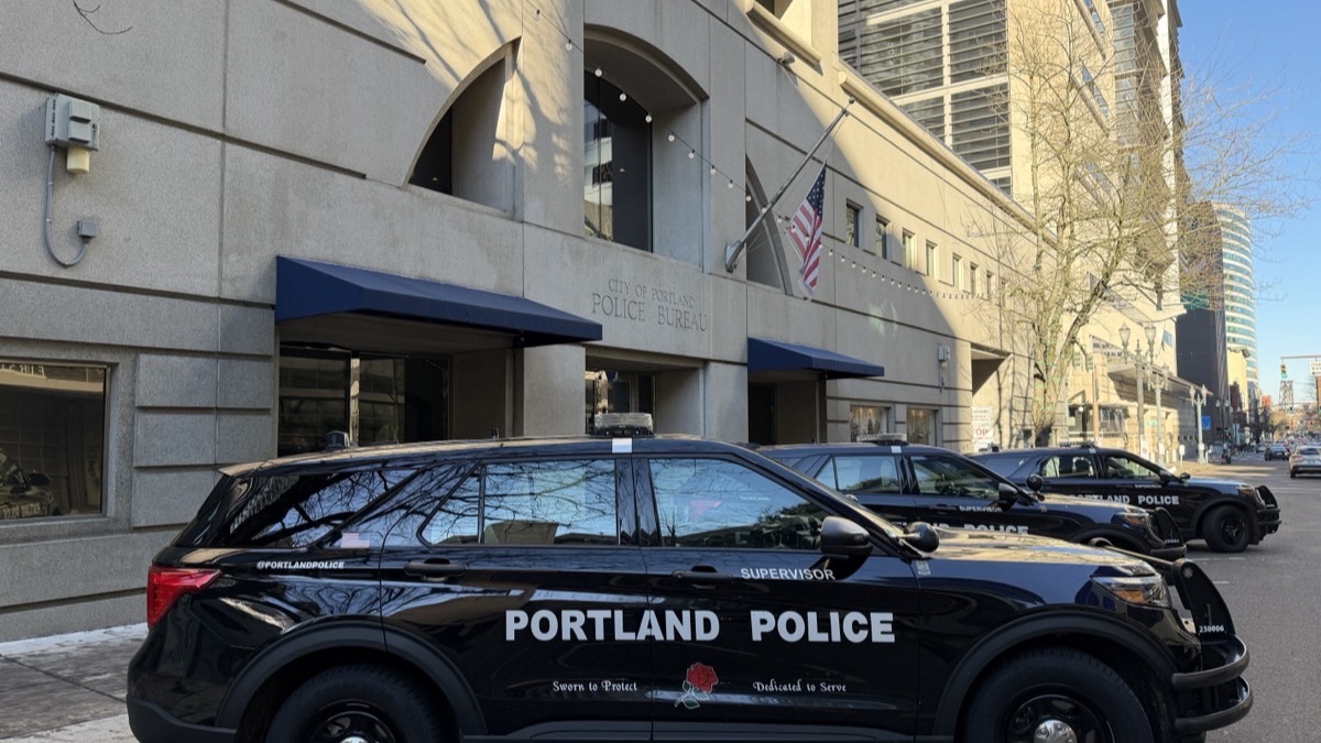 Portland Police Bureau headquarters at the Justice Center with a marked police SUV parked in front