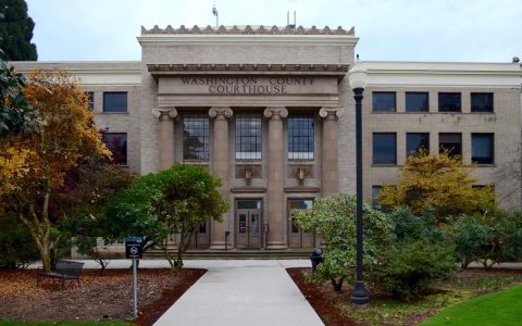 The front of the Washington County Courthouse with columns and a walkway